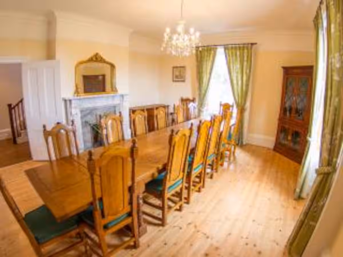 Dining room with a long table and classic furnishings